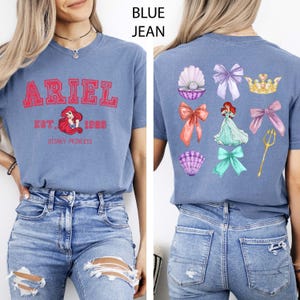 This charming Little Mermaid shirt features Princess Ariel in a soft coquette style, printed on a Comfort Colors tee. Perfect for Disney girls’ trips, Magic Kingdom visits, or everyday Disney fans who adore classic princess style. The soft vintage tones make it a cute and magical wardrobe addition for your next Disneyland adventure.
