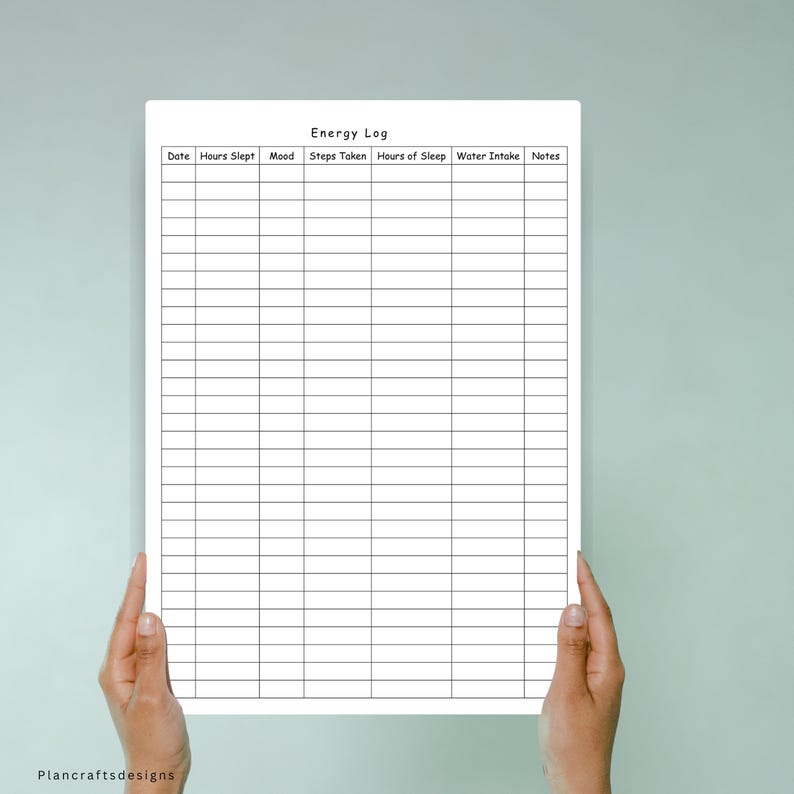 May include: A white paper energy log tracker with black grid lines and headers for Date, Hours Slept, Mood, Steps Taken, Hours of Sleep, Water Intake, and Notes. The document features a clean, organized layout for daily health and wellness tracking.