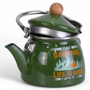 May include: Green enamel camping kettle with a silver handle and lid. The kettle features the text "I Love Camping, Life is Good" with a camping scene graphic. The lid has a wooden knob.