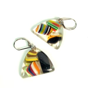 May include: A pair of clear, triangular earrings with colorful, layered designs inside. The earrings feature a variety of colors, including red, yellow, blue, and black, and have silver-colored lever-back closures.