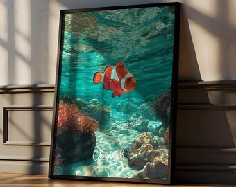 May include: A framed wall art print featuring an orange and white clownfish swimming in clear turquoise water above a coral reef. The artwork displays a vibrant underwater scene with light rays filtering through the surface and the word Clownfish.