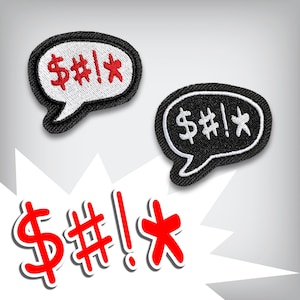 May include: Two embroidered patches in speech bubble shapes, one white with red text and the other black with white text. The text includes a dollar sign, a hashtag, an exclamation point, and an asterisk. A larger red graphic of the same text is below.