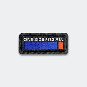 May include: A black embroidered patch with the text "ONE SIZE FITS ALL" in white. The patch features a blue bar and a small orange bar. The patch has a black border.
