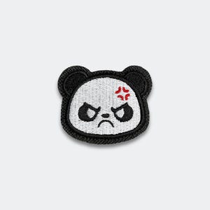 May include: Embroidered patch featuring an angry panda face. The panda has black ears, eyes, and outline, with a white face. A red symbol of anger is above the eyes. The panda has a sad mouth.