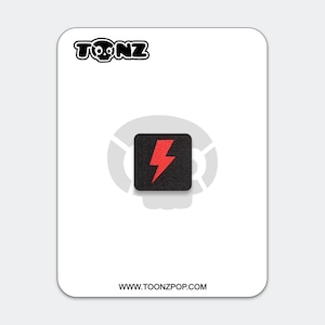 May include: A square black patch featuring a red lightning bolt graphic centered on a white backing card. The card displays the text TONZ at the top with a skull icon and the website URL WWW.TOONZPOP.COM at the bottom, with a faint skull logo.