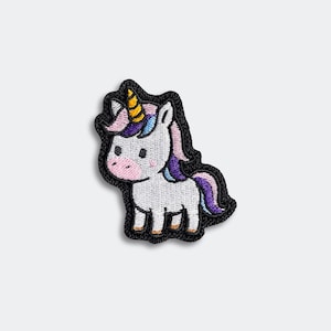 May include: Embroidered patch featuring a cartoon unicorn. The unicorn has a white body, pink cheeks, and a yellow horn. Its mane and tail are a mix of purple, blue, and pink. The patch is outlined in black.