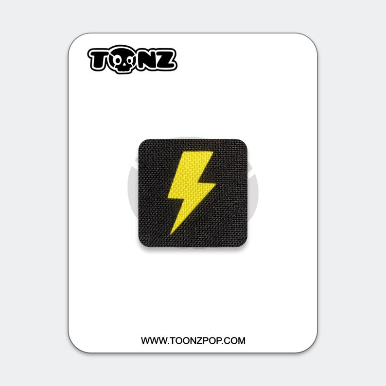 May include: A square black patch featuring a bright yellow lightning bolt icon in the center. The patch is displayed on a white backing card with the text TONZ at the top and the website URL WWW.TOONZPOP.COM printed at the bottom.