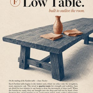 May include: A long, low, dark-stained wooden table with a visible grain texture, featuring a trestle base with mortise and tenon joinery. A small, light-brown ceramic vase and two folded tan fabric napkins sit on the rectangular tabletop surface.