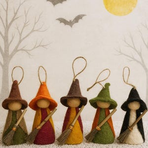 May include: Five felt witch ornaments with pointed hats and broomsticks. Each witch has a different colored hat and outfit, including brown, orange, green, and black. The background features a Halloween scene with bats, trees, and a yellow moon.