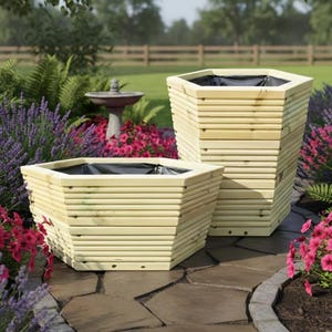 May include: Two hexagonal planters constructed from light-coloured horizontal wooden slats. Each planter features a black interior liner and a wide, open top. The planters are positioned on a stone patio surface, showcasing a natural wood finish.