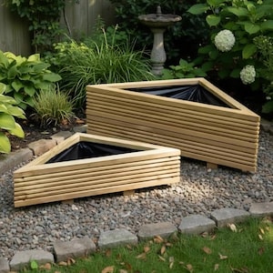 May include: Two triangular wooden planters with horizontal slatted sides and black plastic liners. The planters are constructed from light-coloured wood with a ribbed texture, featuring a hollow centre for planting and small wooden feet for elevation.