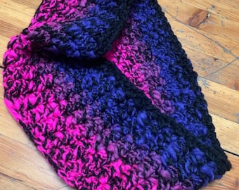 Hand spun cowl in bright pink, cobalt and purple on black