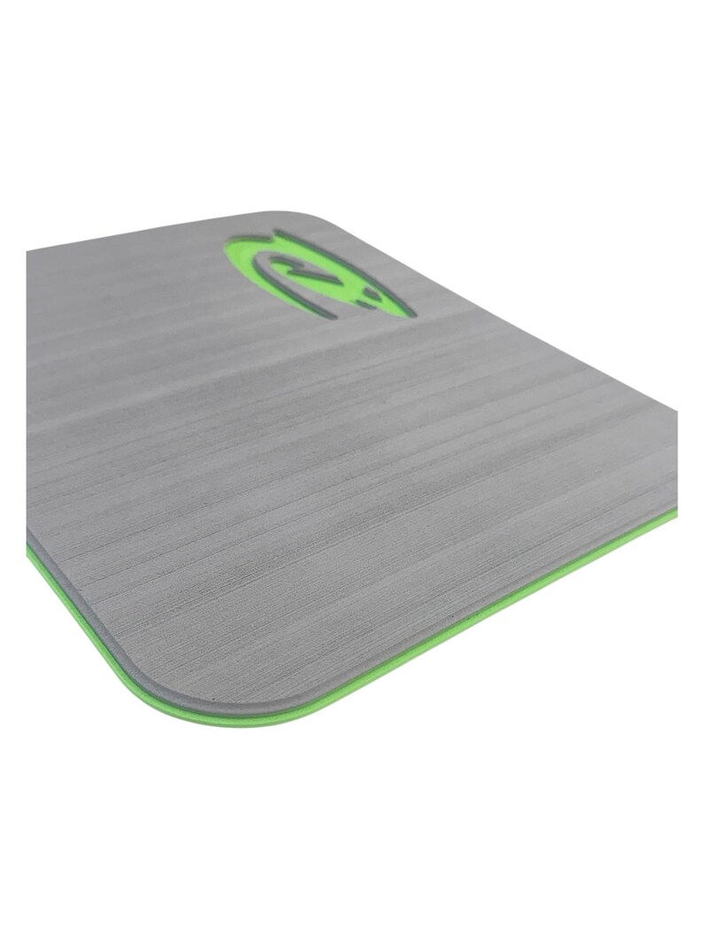 May include: Gray rectangular exercise mat with a green border and a green logo in the upper right corner. The mat has a textured surface.