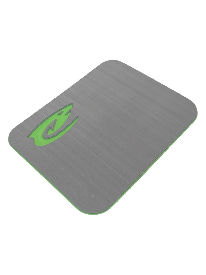 May include: A rectangular gray mousepad with a green border and a green logo in the upper left corner. The mousepad has a brushed metal texture.