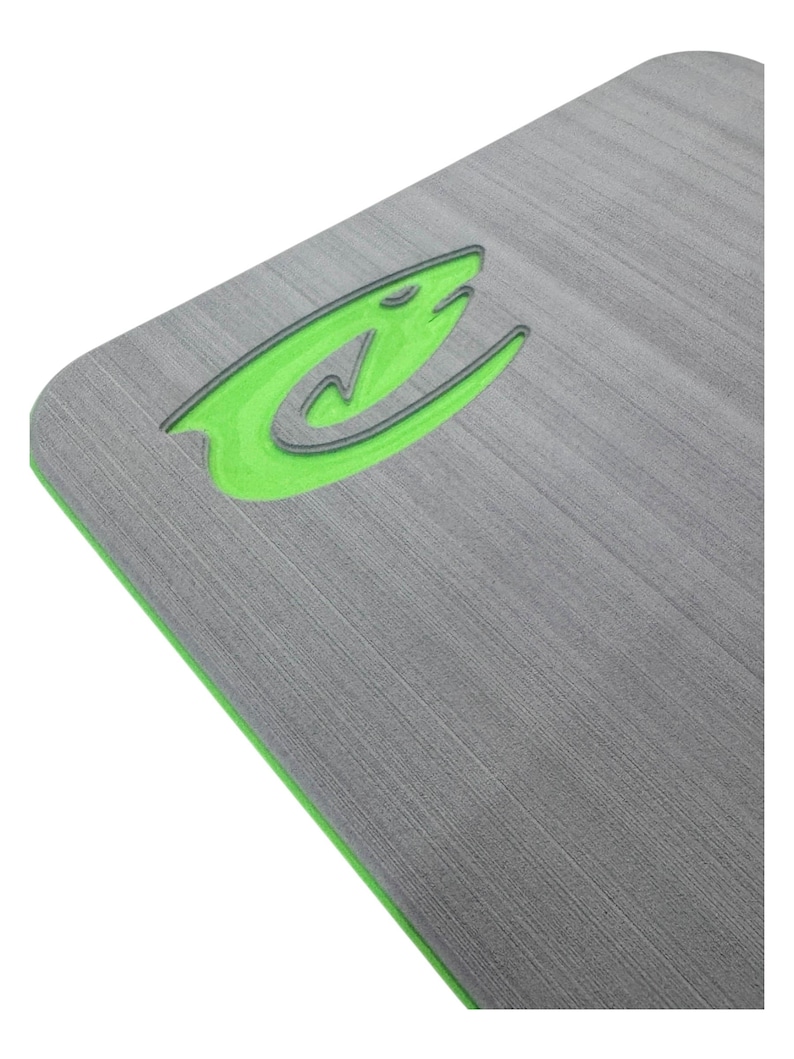 May include: A gray rectangular mat with a textured surface and a bright green border. A stylized green logo with a black outline is in the upper left corner. The logo appears to be a shark or fish.