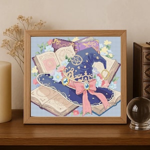 May include: A framed illustration of a witch's hat, books, and flowers. The navy blue hat features gold stars and a pentagram. A pink bow adorns the hat. Open books with floral accents surround the hat, creating a whimsical, magical theme.