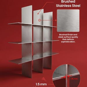 May include: A brushed stainless steel shelving unit with a grid design. The metal panels have a 1.5 mm thickness. Text on the image includes: Brushed Stainless Steel, Brushed finish and sleek surface quality that defines sophistication, and 1.5 mm Thickness.