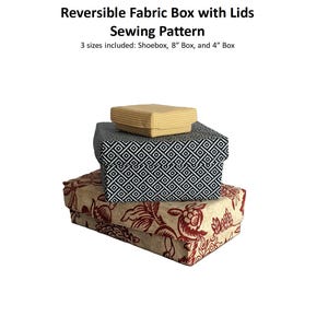 May include: Three fabric boxes with lids, stacked. The boxes feature diverse patterns: a floral print, a black and white geometric design, and a yellow checkered pattern. Text reads: Reversible Fabric Box with Lids Sewing Pattern. Sizes include Shoebox, 20cm Box, and 10cm Box.