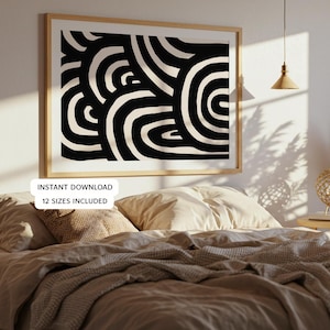 May include: A framed abstract art print featuring a black and cream-colored design of curved shapes. The artwork is displayed above a bed with neutral-toned bedding. Text on the image reads "INSTANT DOWNLOAD 12 SIZES INCLUDED."
