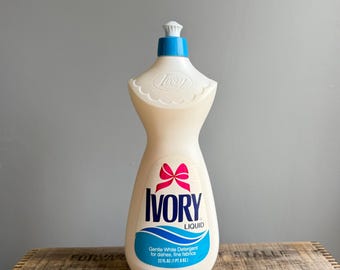 Détergent liquide vintage ivoire : années 1970-1980, bouteille pleine, noeud rose