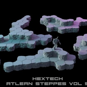 May include: A collection of gray, multi-level hexagonal terrain tiles with rocky, textured sides. The set includes various shapes and sizes, featuring two small robot figurines. The text HEXTECH ATLEAN STEPPES VOL 5 is printed at the bottom.