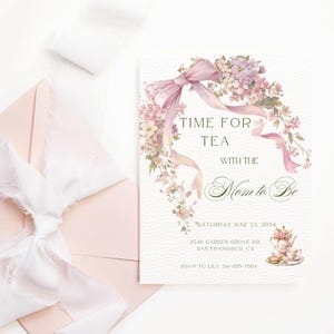 May include: A light pink invitation card with the text "TIME FOR TEA WITH THE Mom to Be" and floral and ribbon accents. A matching pink envelope and white ribbon are in the background. The invitation includes the date, address, and RSVP information.