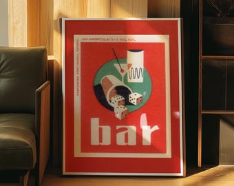 May include: Framed vintage bar advertisement with a red background, featuring a green circle with a cocktail and dice. The word "bar" is in large white letters. The poster is displayed on a wooden floor.
