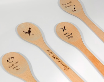 May include: Wooden spoons with engraved designs and text. One spoon says "Grandma's Kitchen" with a ladle icon. Another says "Love served daily" with a crossed knife and fork. Other spoons say "Made with Mom's love" and "Stirred with love".