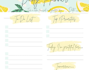 Puede incluir: Un planificador diario con un fondo azul claro e ilustraciones de limones. El planificador incluye secciones para una lista de tareas, las principales prioridades, gratitud y notas. El texto "Daily Planner" está en la parte superior.