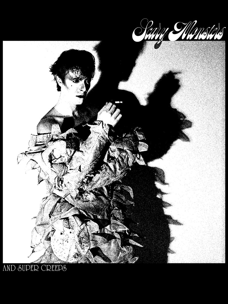 May include: Black and white album cover featuring a person in a textured outfit with the text "Scary Monsters" and "And Super Creeps". The image has a high-contrast, grainy texture, with a large shadow.