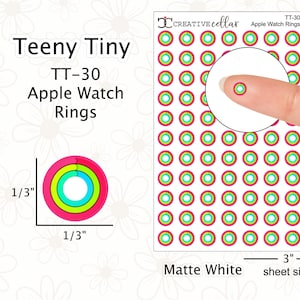 以下が含まれることがあります： マットホワイトのApple Watchリングステッカー30枚入りシート。各ステッカーは直径0.8cmで、ピンク、グリーン、ブルー、イエローのマルチカラーリングデザインが施されています。シートのサイズは7.6cm x 12.7cmです。