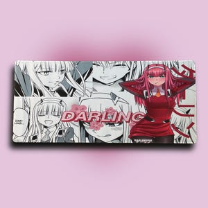 May include: Rectangular tray featuring anime-style illustrations in black, white, and red. The word "DARLING" is prominently displayed with cherry blossom accents. The tray has a glossy finish and is set against a pink background.