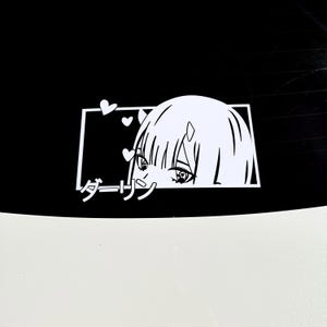 May include: A white sticker with an anime-style character design. The character has large eyes and short hair, enclosed in a white rectangle. The Japanese word "Darling" is written below. Small white hearts are also present above the character's head.