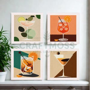 May include: Four square canvas art prints depicting cocktail illustrations. Each print shows a different cocktail with fruit garnishes, including orange and lime slices. The prints have a neutral background and are framed in white.