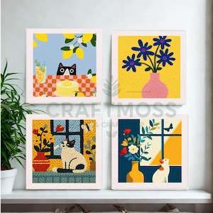 May include: Four framed art prints with cat and floral designs. One shows a black cat peeking over a table with lemons. Another displays blue flowers in a pink vase. The other two show cats near windows with flowers.