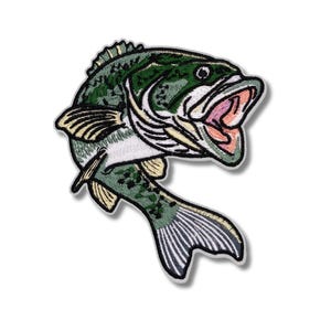 May include: Embroidered patch featuring a detailed illustration of a largemouth bass. The fish is depicted in shades of green, white, and black, with its mouth open. The patch is designed with a white border.
