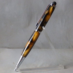 May include: A brown and black patterned pen with a silver clip and stylus tip.