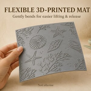 May include: A square, gray, flexible 3D-printed mat featuring embossed marine designs including a starfish, sea urchin, and coral branches. The text "FLEXIBLE 3D-PRINTED MAT" and "Gently bends for easier lifting & release" and "Not silicone" appear.