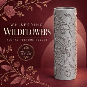 May include: A cylindrical gray texture roller featuring an embossed floral pattern of wildflowers. The text on the image reads Whispering Wildflowers Floral Texture Roller and Embossed Texture. The design includes detailed stems and petals.