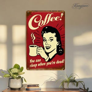 May include: A vintage-style metal sign with a red background and the word "Coffee!" in white script. It features a smiling woman holding a coffee mug, with the text "You can sleep when you're dead!"