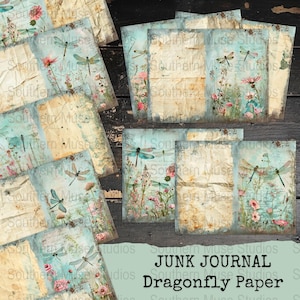 May include: A collection of distressed paper sheets with a vintage aesthetic. Each sheet features a light blue background with dragonfly illustrations and floral accents. The text "JUNK JOURNAL Dragonfly Paper" is visible.