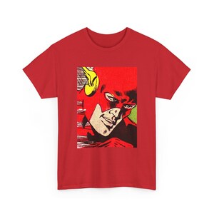 May include: Red t-shirt with a comic book illustration of The Flash. The image depicts the superhero's face in a red mask with yellow details. The shirt is a plain red colour.