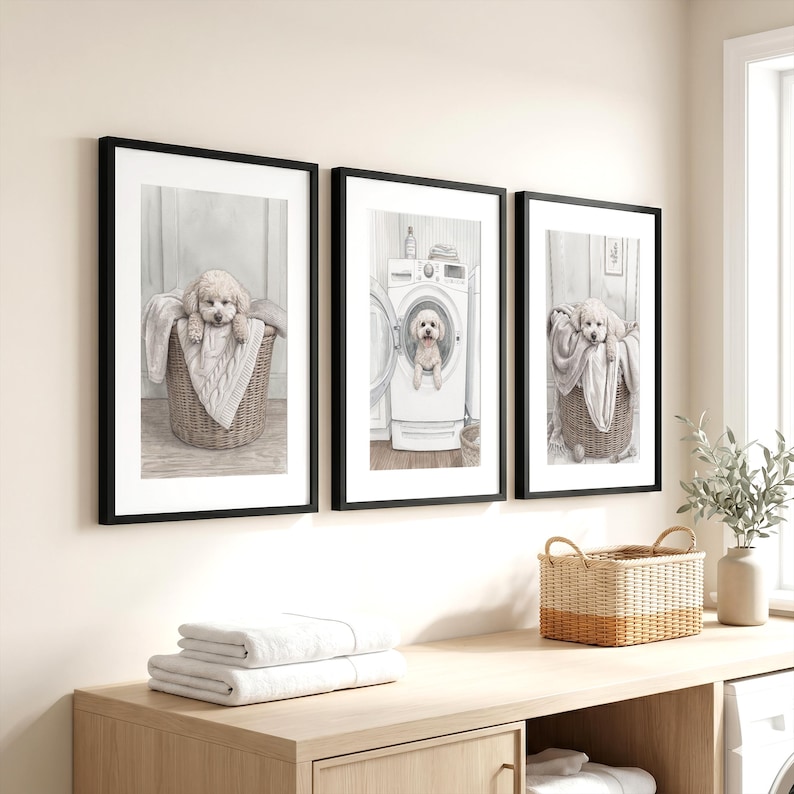 May include: Three framed wall art prints featuring a light-colored dog. The left and right prints show the dog in a wicker basket with a blanket. The center print shows the dog inside a white washing machine. All frames are black with white mats.
