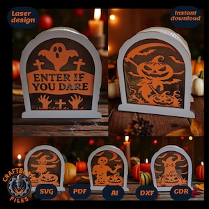 Puede incluir: Decoraciones de Halloween cortadas con láser en forma de lápidas. Los diseños presentan siluetas naranjas de fantasmas, calabazas y esqueletos. Una lápida dice "ENTER IF YOU DARE". Las decoraciones se muestran con calabazas y velas.