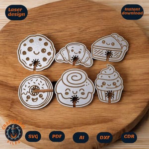 Puede incluir: Diseños de madera cortados con láser con temática de comida, que incluyen una galleta, un cruasán, una porción de tarta, un donut, un rollo de canela y una magdalena. Cada diseño tiene una cara sonriente y una ranura para un palito. Las palabras "Laser design" e "Instant download" son visibles.