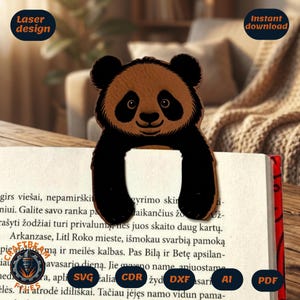 May include: A laser-cut panda bookmark with a brown head and black body, placed on a book. The bookmark has the words "Laser design" and "Instant download" on the image.