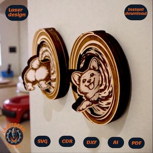 May include: Two layered wooden wall decorations featuring a Corgi dog. One piece shows the dog's rear, and the other shows the dog's face emerging from a swirling tunnel. Text includes Laser design, Instant download, SVG, CDR, DXF, AI, and PDF.