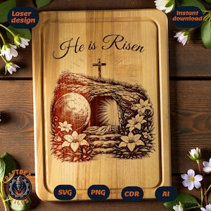 May include: Wooden chopping board with a laser-engraved design. The design features the text "He is Risen", a cross, and an empty tomb with a large stone and flowers. The board is rectangular with rounded corners.