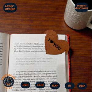 May include: A brown heart-shaped leather corner bookmark featuring the text I LOVE YOU with a heart symbol, placed on the corner of an open book page. The text Laser design and Instant download appear in the corners of the image.