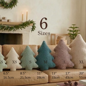 May include: Six tree-shaped throw pillows in various colors and sizes, ranging from 6.5 inches to 20 inches. The textured, plush pillows are labeled XXS, XS, S, M, L, and XL, with corresponding measurements in inches and centimeters.